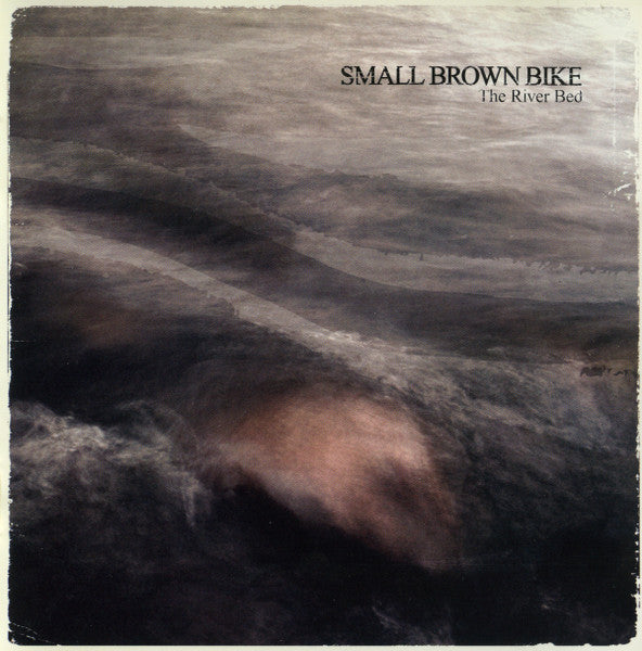 SMALL BROWN BIKE  - RIVER BED
